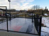 Hockey Canada logo court flooded in winter.
